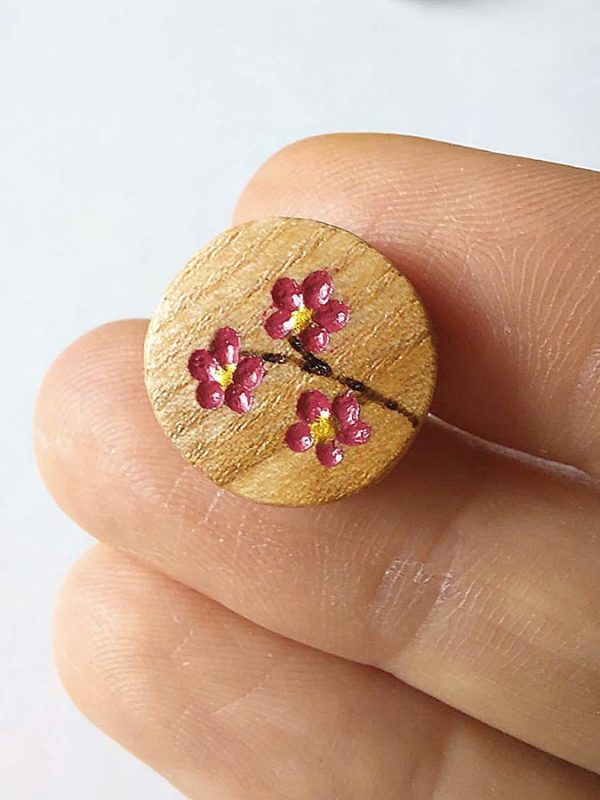 f9fe99dc-0f3f-4c30-8b36-428ff47aa4d1 Origine - Boucles d'oreilles puces en bois